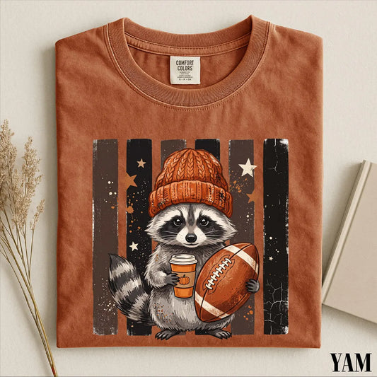 Raccoon Football Shirt, Cute Game Day Graphic Tee, Fall Sports Animal Shirt, Football Season Comfort Colors T-Shirt Gift 103080d9-737a-43ad-a1bb-56b4b9e4da2d-1.webp