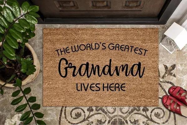 The World's Greatest Grandma Lives Here Printed Doormat Floor Rug Housewarming Gift Home Living Home Decor Indoor and Outdoor Doormat Warm House Gift Welcome Mat Gift for Friend Family 1626835357337.jpg