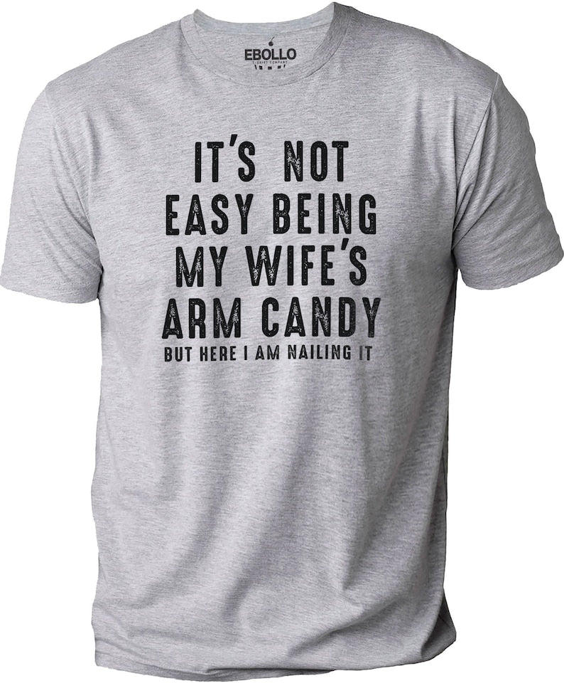 Its Not Easy Being My Wifes Arm Candy  Funny Shirt Men   Fathers Day Gift   Husband Shirt   Dad Gift   Gift For Husband   Funny Dad Tee 1712309371878.jpg