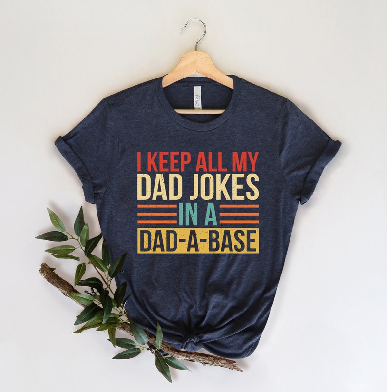 i keep all my dad jokes in a dad a base shirt new dad shirt fathers day shirt best dad shirt gift for dad 1714617746398.jpg