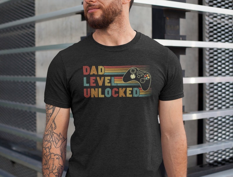 dad level unlocked shirt funny new dad t shirt dad gaming shirt first time dad fathers day gift idea new super dad announcement shirt 1715843374298.jpg