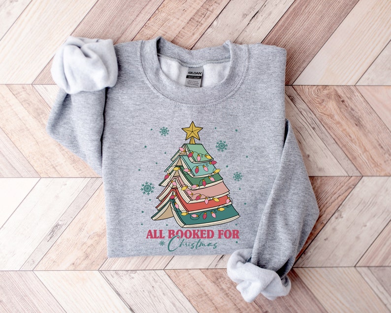 all booked for christmas shirt gift for librarianbookworm christmas sweaterchristmas book tree sweatshirtbook lovers christmas sweatshirt 1724989949818.jpg