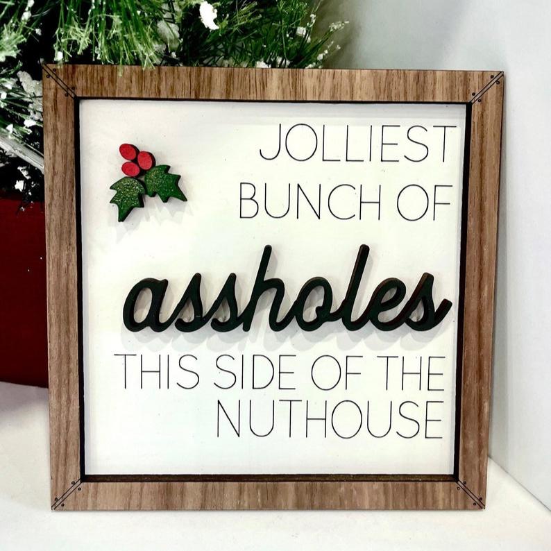 jolliest bunch of assholes this side of the nuthouse  funny christmas sign  christmas vacation  chevy chase  unique christmas gift 1726285519876.jpg