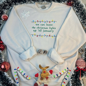 we can leave the christmas lights up til january sweatshirt  embroidered christmas lights cut hem sweatshirt side bow appliqu sweatshirt 1730362692487.png