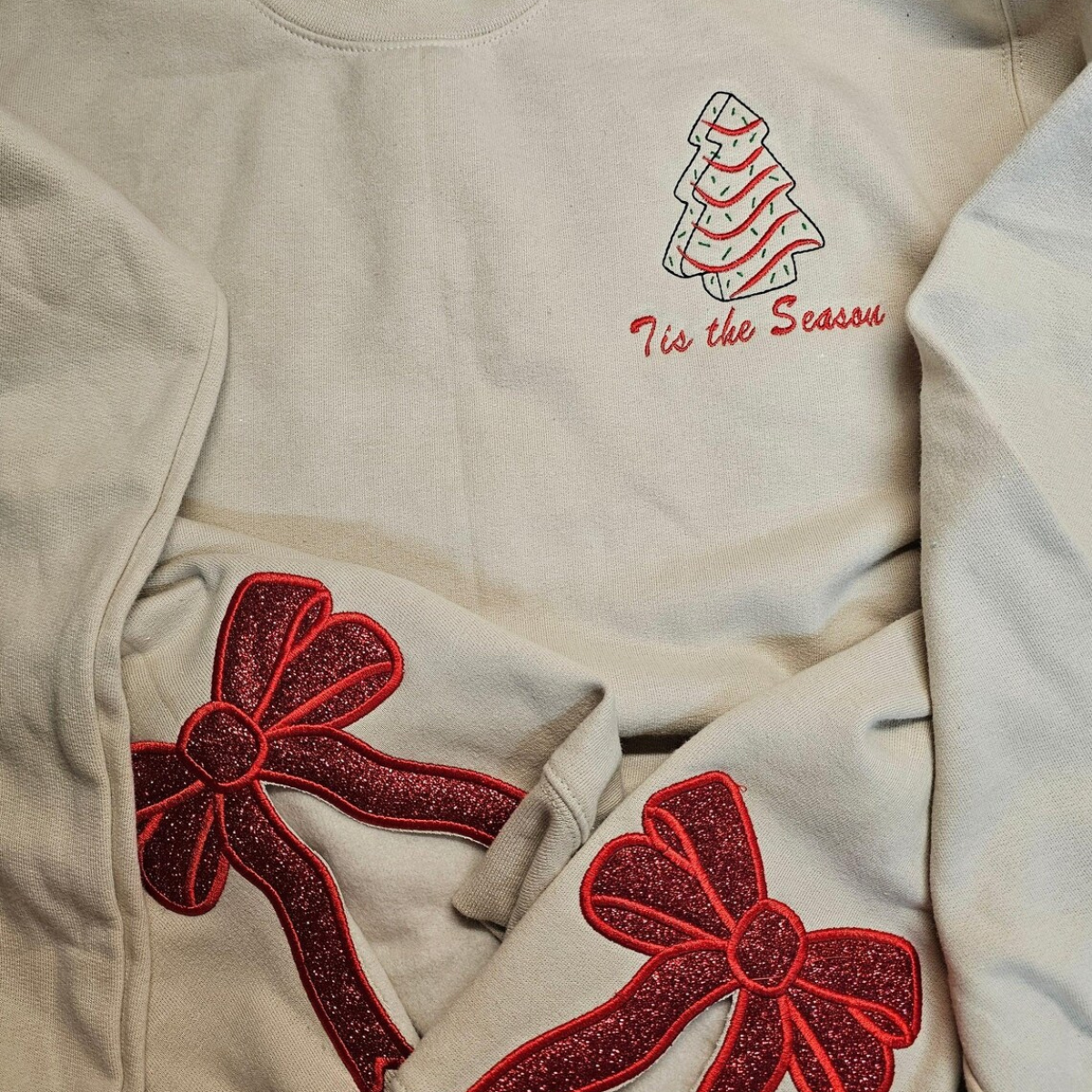 merry side bow embroidered sweatshirt glitter christmas sweatshirt side bow applique hoodie christmas bow shirttis the season shirt 1732519675816.png