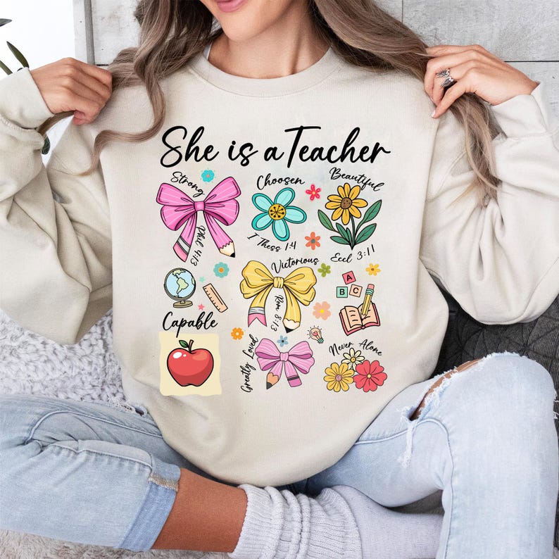 She Is Teacher Shirt Teacher Mom T Shirt Christian Teacher Shirt Bible Verses Shirt Teacher Floral Mother S Day Gift Teacher Coquette Bow Sweatshirt 1751532120377.jpg