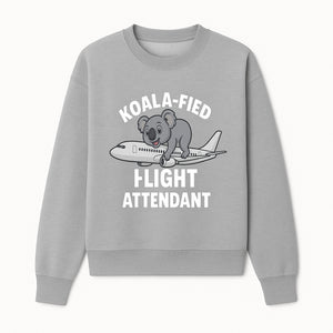 Koala-Fied Flight Attendant T-Shirt | Cute Aviation Animal Graphic Tee for Travelers & Flight Crew | Fun Gifts for Air Travel Lovers - Sweatshirt 1758254677413.jpg
