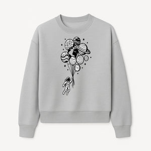 Astronaut Holding Planet Balloons Graphic T-Shirt | Space Adventure Design | Galaxy-Themed Apparel for Kids and Adults - Sweatshirt 1758273120475.jpg