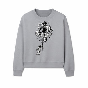 Astronaut Holding Planet Balloons Graphic T-Shirt | Space Adventure Design | Galaxy-Themed Apparel for Kids and Adults - Sweatshirt 1758273121344.jpg