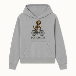 Doxycycline Dog Bicycle Art Print | Cute Dog Riding Bike Wall Decor | Pet Lover Gift | Whimsical Animal Illustration - Hoodie 1758347421170.jpg