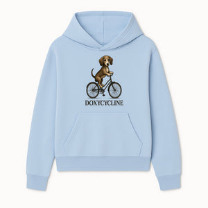 Doxycycline Dog Bicycle Art Print | Cute Dog Riding Bike Wall Decor | Pet Lover Gift | Whimsical Animal Illustration - Hoodie 1758347421314.jpg