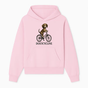 Doxycycline Dog Bicycle Art Print | Cute Dog Riding Bike Wall Decor | Pet Lover Gift | Whimsical Animal Illustration - Hoodie 1758347421451.jpg