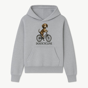 Doxycycline Dog Bicycle Art Print | Cute Dog Riding Bike Wall Decor | Pet Lover Gift | Whimsical Animal Illustration - Hoodie 1758347422059.jpg