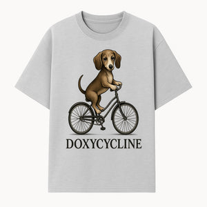 Doxycycline Dog Bicycle Art Print | Cute Dog Riding Bike Wall Decor | Pet Lover Gift | Whimsical Animal Illustration - T-shirt 1758347423579.jpg