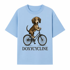 Doxycycline Dog Bicycle Art Print | Cute Dog Riding Bike Wall Decor | Pet Lover Gift | Whimsical Animal Illustration - T-shirt 1758347424303.jpg
