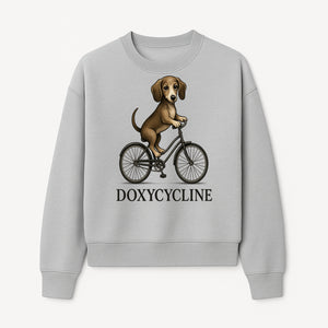 Doxycycline Dog Bicycle Art Print | Cute Dog Riding Bike Wall Decor | Pet Lover Gift | Whimsical Animal Illustration - Sweatshirt 1758347427054.jpg