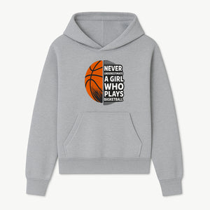 Never Underestimate a Girl Who Plays Basketball T-Shirt - Motivational Sports Gift for Female Athletes - Hoodie 1758681894558.jpg