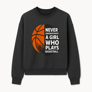 Never Underestimate a Girl Who Plays Basketball T-Shirt - Motivational Sports Gift for Female Athletes - Sweatshirt 1758681899371.jpg