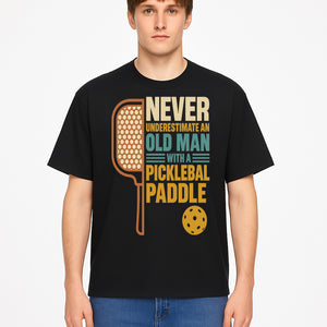 Never Underestimate an Old Man with a Pickleball Paddle - Funny Pickleball T-shirt Gift for Players and Seniors - T-shirt 1758685043972.jpg