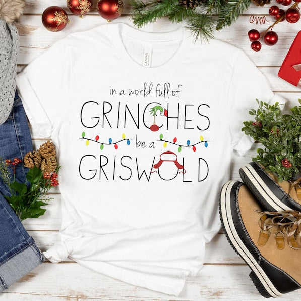 In A World Full Of Grinches Be A Griswold Shirt Grinches Griswold Christmas Sweatshirt Christmas Gift Christmas Vacation Movie Sweatshirt 1761280011709.jpg