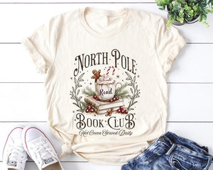 Retro Funny North Pole Book Club Book Lover Christmas Bookish Christmas Graphic Tshirt For Women 1761550946342.jpg