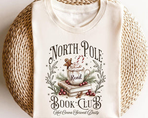 Retro Funny North Pole Book Club Book Lover Christmas Bookish Christmas Graphic Tshirt For Women 1761550946813.jpg