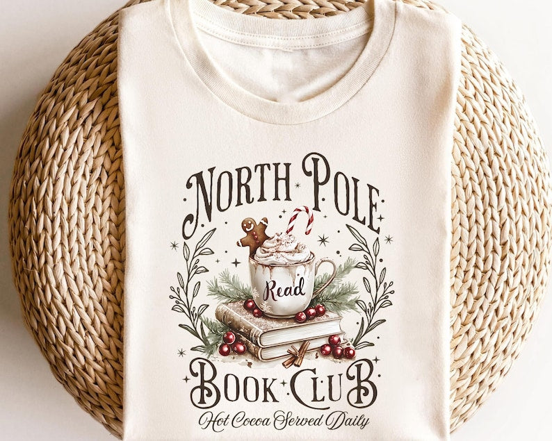 Retro Funny North Pole Book Club Book Lover Christmas Bookish Christmas Graphic Tshirt For Women 1762157930149.jpg