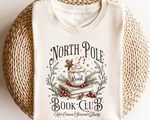Retro Funny North Pole Book Club Book Lover Christmas Bookish Christmas Graphic Tshirt For Women 1762157930149.jpg