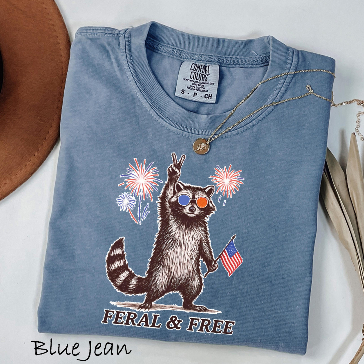 Comfort Colors Feral But Free Raccoon Shirt Funny 4th Of July Tee Patriotic Raccoon Shirt Independence Day Outfit Usa Raccoon Tee 1782099944001.png