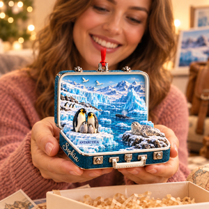 Personalized Antarctica 3D Suitcase Christmas Ornament – Antarctic Travel Souvenir & Gift for Penguin Lovers bda0a869-a979-434c-8540-9e5040e74f87-Woman-admiring-an-Antarctic-suitcase-ornament-2.png