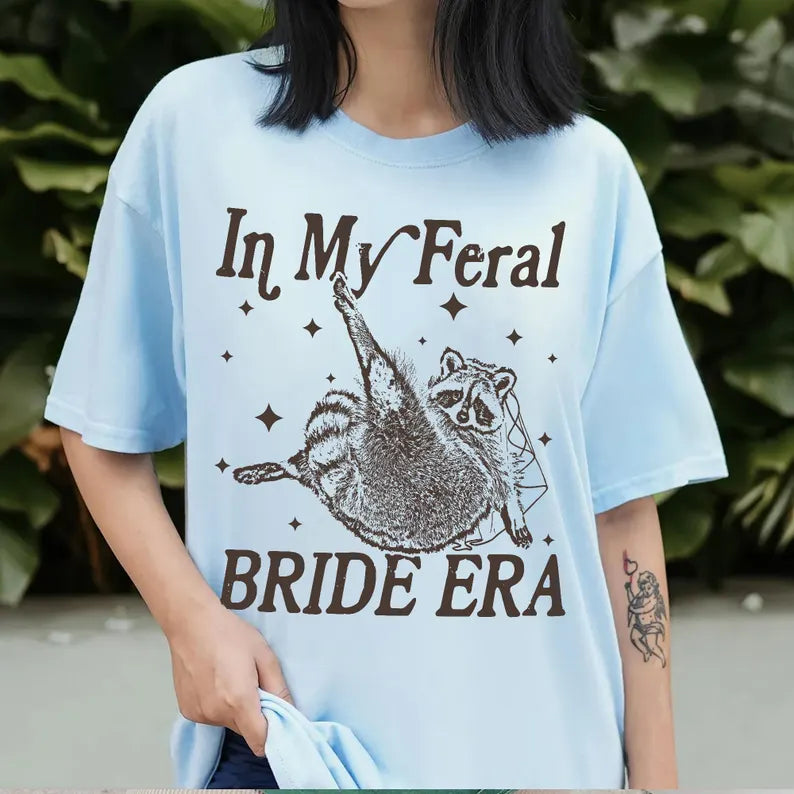 In My Feral Bride Era Shirt, Funny Raccoon, Funny Bride Shirt, Gift For Bride To Be, Engagement Gift, Wedding Planning, Bridal Meme Shirt d3133d63-5fc6-4ab3-81ff-a4640c6e0320-dgfdfrewtyjhj-2-.webp