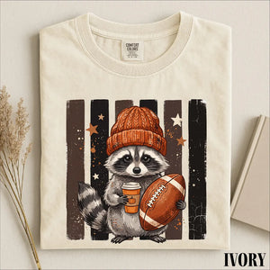 Raccoon Football Shirt, Cute Game Day Graphic Tee, Fall Sports Animal Shirt, Football Season Comfort Colors T-Shirt Gift fa5d9c57-fec3-408e-a081-86f5245941cf-2.webp