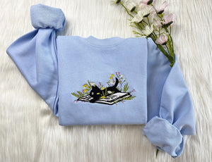 Embroidered Cute Cat Lying On Book With Flower Sweatshirt | Flower With Cat Embroidered Hoodie | Book Lover T-Shirt | Crew Neck Sweatshirt il_794xN.5469431997_8004.jpg