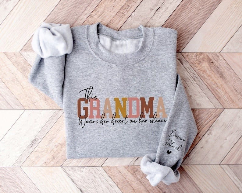 Custom This Grandma Wears Her Heart On Her Sleeve Sweatshirt, Personalized Mimi Hoodie With Grandchilds Names, Nana Outfit, Mothers Day Gift