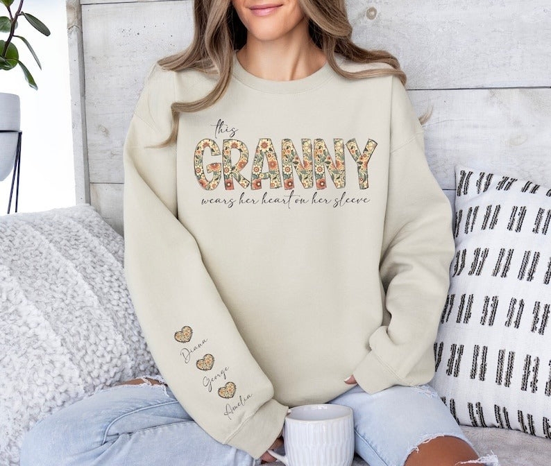 Custom This Grandma Wears Her Heart On Her Sleeve Sweatshirt, Shirt with Names On Sleeve, Mommy Heart Hoodie, Valentine's Day Grandma Gift