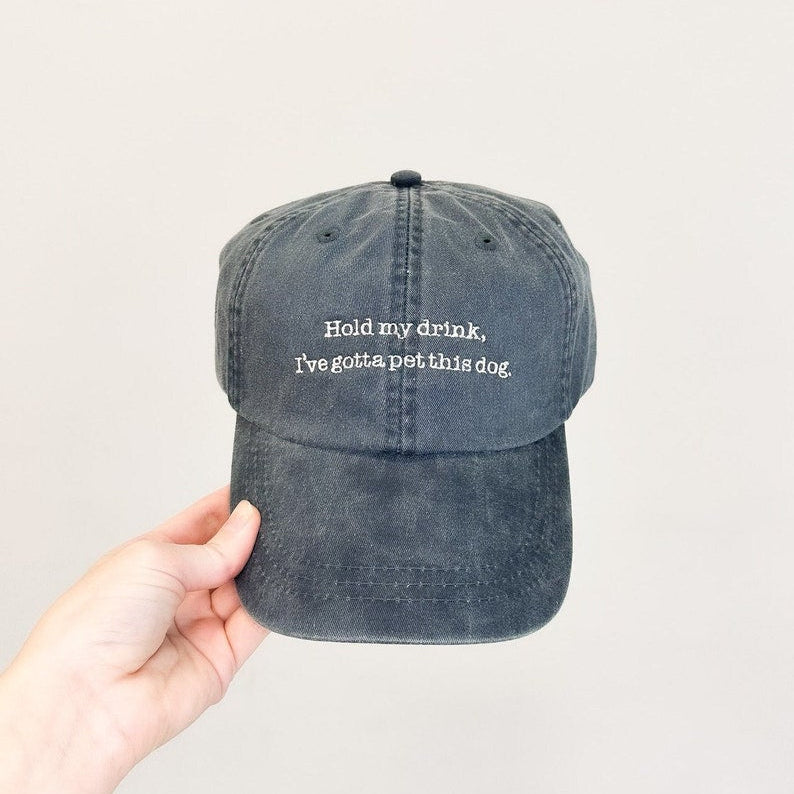 Hold My Drink, I've Gotta Pet This Dog Embroidered Pigment-Dyed Baseball Cap (Typewriter Font)