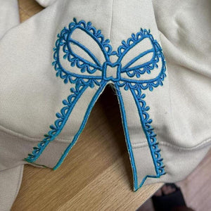 Custom Nana Est Embroidered Christmas Bow Embellished Shirt, Colorful Custom Side Bow Cut-Out Sweatshirt, Christmas Gift Hoodie