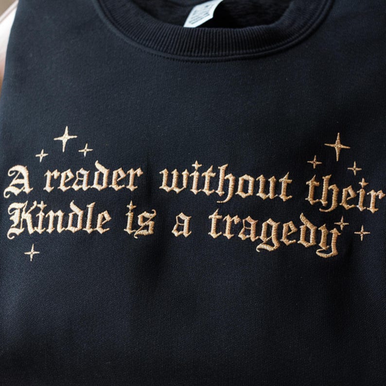 Embroidered Book Lover Sweatshirt A Reader Without Their Kindle Quote Sweater, Reading Gift, Dark Academia Aesthetic Pullover il_794xN.7056580024_hrjd.jpg