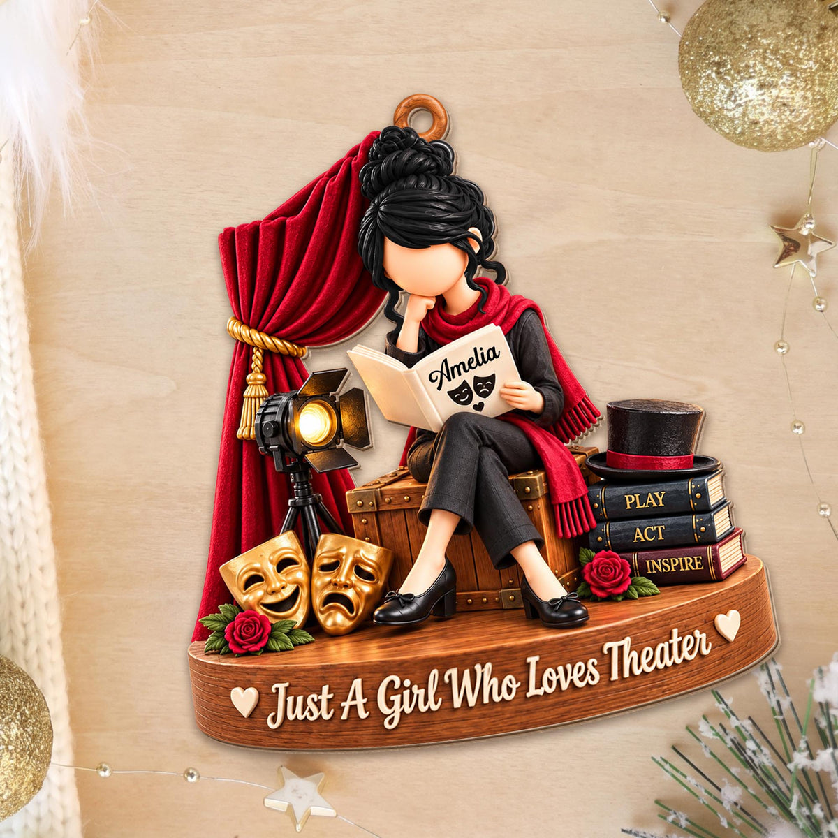 Personalized theater ornament on a festive wooden surface