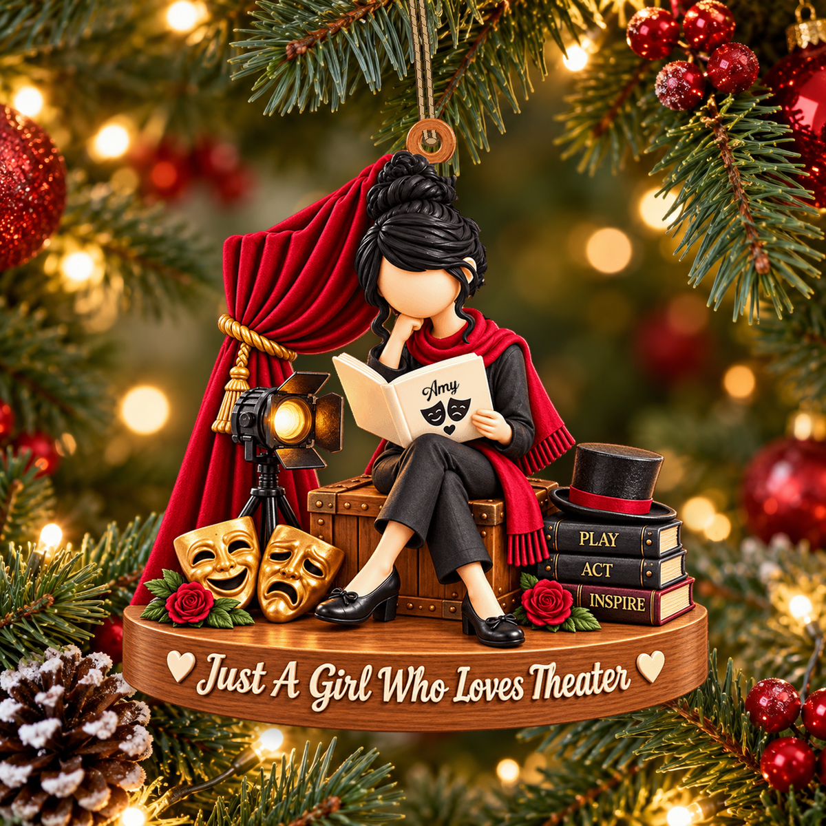 Personalized theater ornament hanging in Christmas tree scene